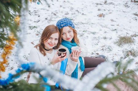 Sisters with cupの写真素材