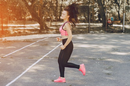 sports girl in parkの写真素材