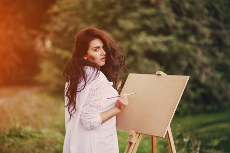 Artist girl in parkの写真素材
