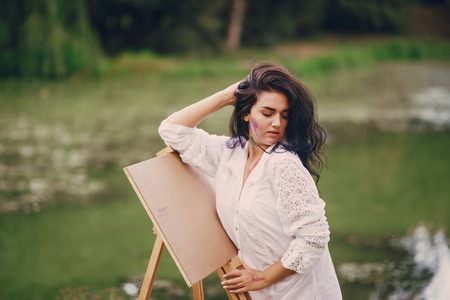 Artist girl in parkの写真素材