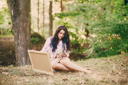 Artist girl in parkの写真素材