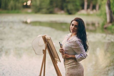 Artist girl in parkの写真素材