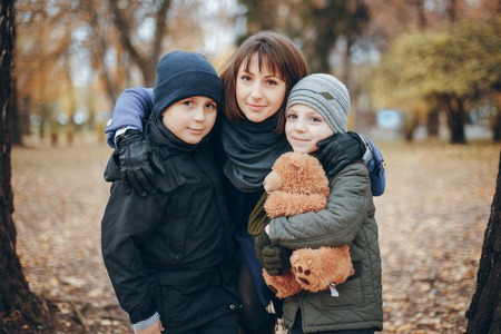 brothers with her motherの写真素材