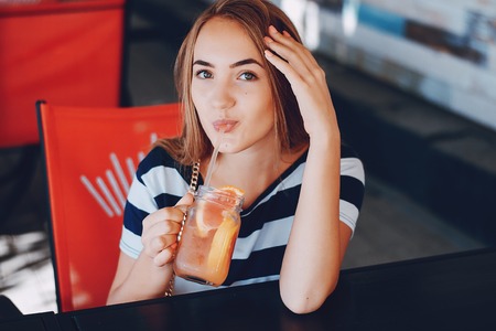 Girl with a cocktailの写真素材