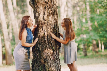 sisters in the parkの写真素材