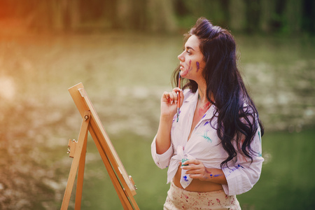 Artist girl in parkの写真素材