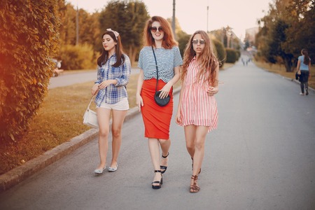 Three girls on a walkの写真素材