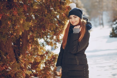 girl walking in a winter cityの写真素材