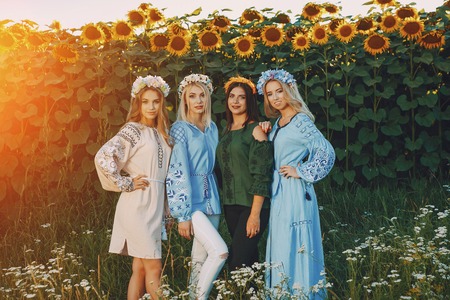 girls and sunflowersの写真素材