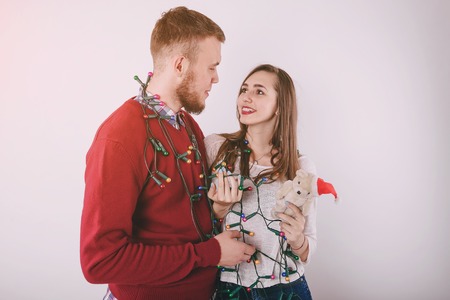 loving couple decorating Christmas treeの写真素材