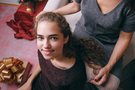 girl getting her hair braidedの写真素材