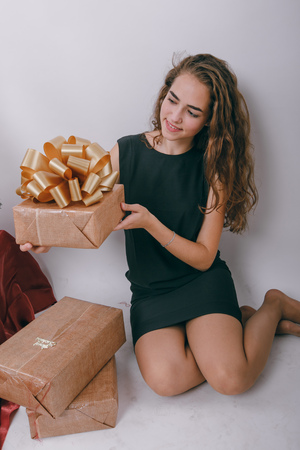 girl in holiday spirit decorating the Christmas treeの写真素材