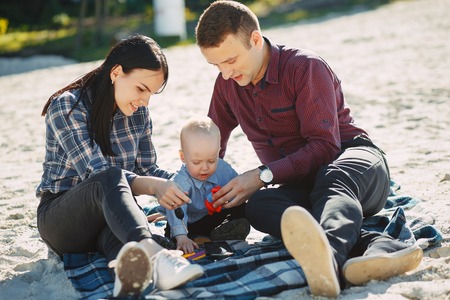 cute family playing in the parkの写真素材