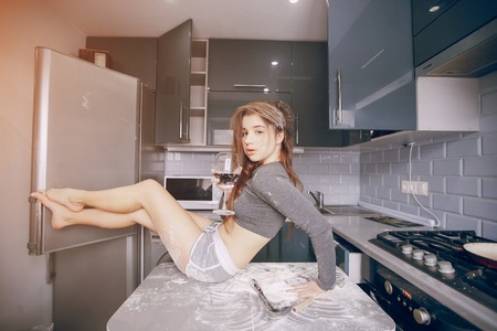 Girl in the kitchenの写真素材