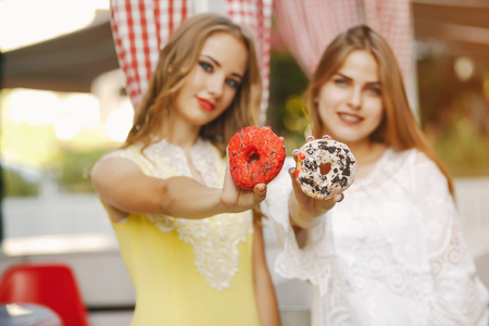 girls with donutの写真素材