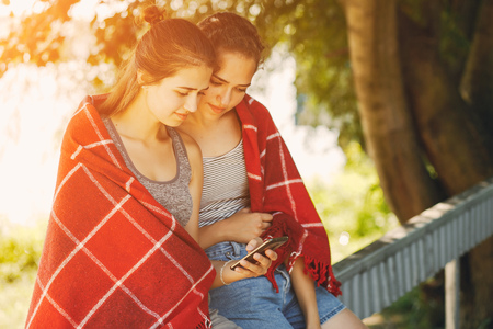 sisters in a parkの写真素材