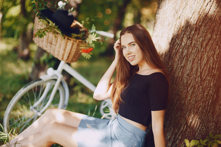 Girl with a bikeの写真素材