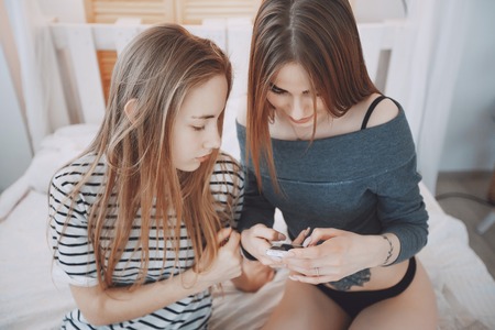 Girls in bedの写真素材