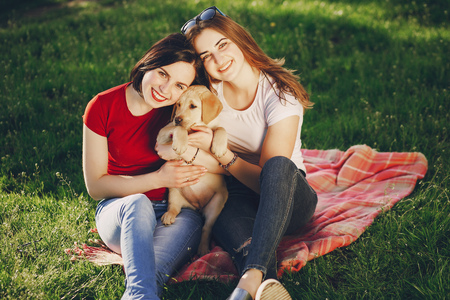 girls with dogの写真素材