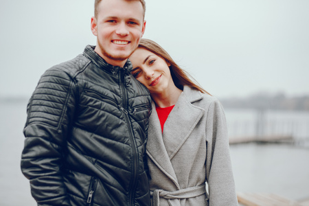 Loving couple walking around the river.の写真素材