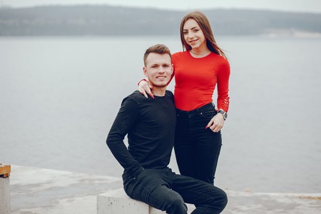 Loving couple walking around the river.