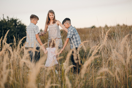 kids in a fieldの写真素材