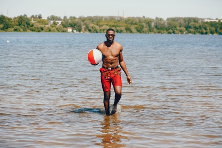 Black guy in a summer park