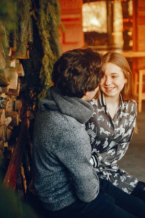 Cute and loving couple in a winter park