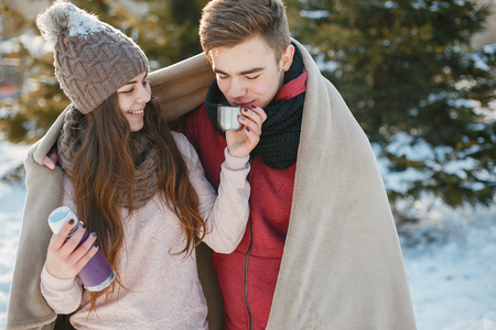 Young Couple in winter park happy and joyfulの写真素材