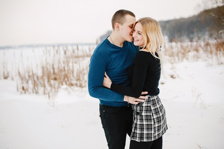 lovely couple in winter park happy and joyfulの写真素材