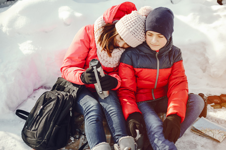Mother and son  in winter park happy and joyful