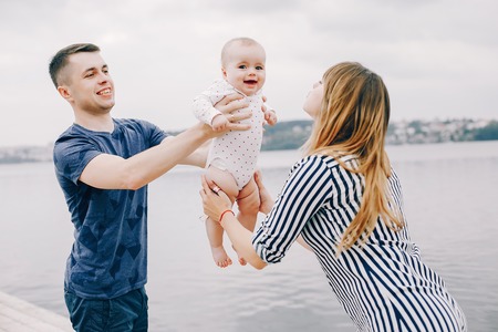 Cute family playing in a summer park