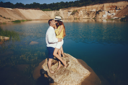 Couple near blue waterの写真素材