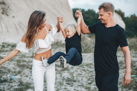 Stylish family in a parkの写真素材