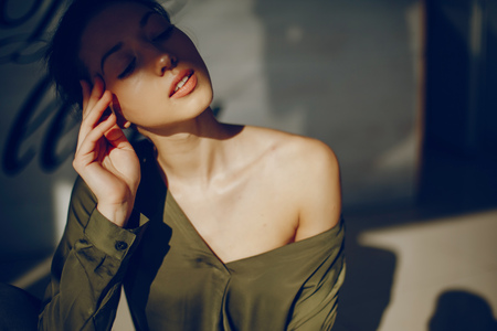 elegant girl in a green blouseの写真素材