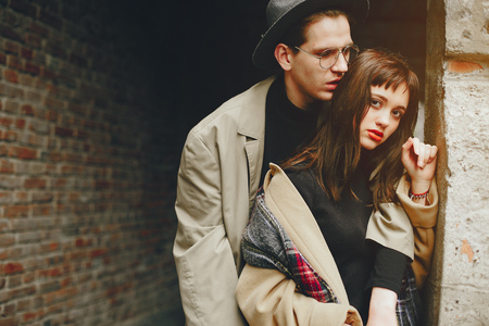 A trendy couple in a gloomy cityの写真素材