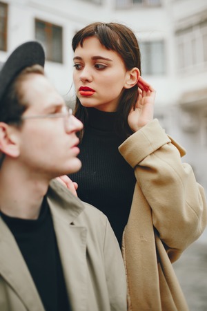 A trendy couple in a gloomy cityの写真素材