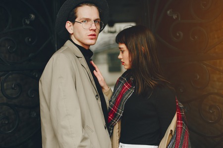 A trendy couple in a gloomy cityの写真素材