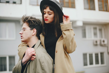 A trendy couple in a gloomy cityの写真素材