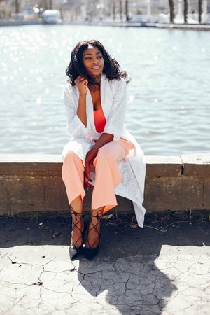 fashionable black girl in a parkの写真素材