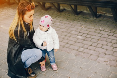young mother with little daughterの写真素材