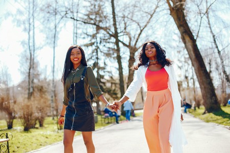 fashionable black girls in a parkの写真素材