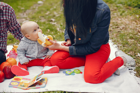 Family in a spring parkの写真素材