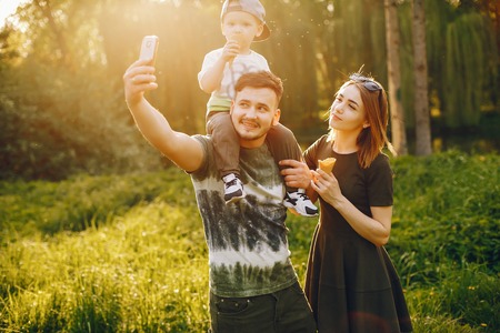 Cute family in a parkの写真素材