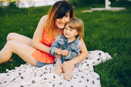 Mother with daughter in a parkの写真素材