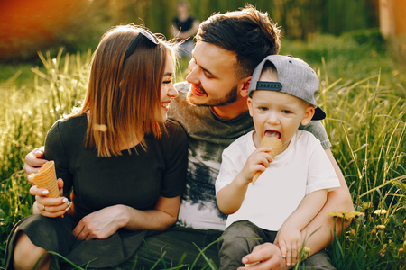 Cute family in a parkの写真素材
