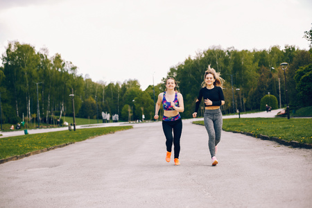 Sports girls in a parkの写真素材