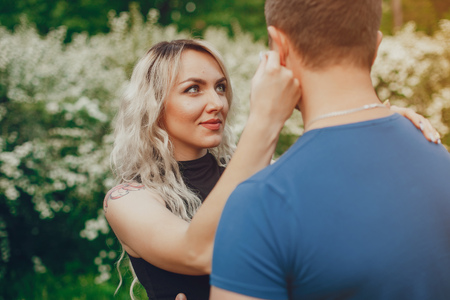 Beautiful couple spend time in a summer parkの写真素材