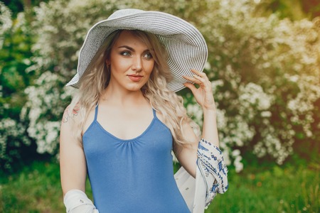 Beautiful pregnancy woman in a summer parkの写真素材