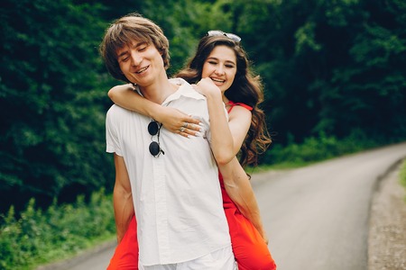 Cute couple in a summer parkの写真素材